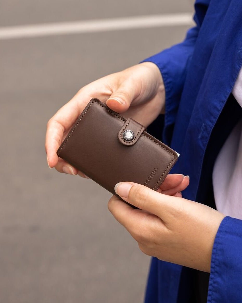 Man holding a Secrid Leather wallet 