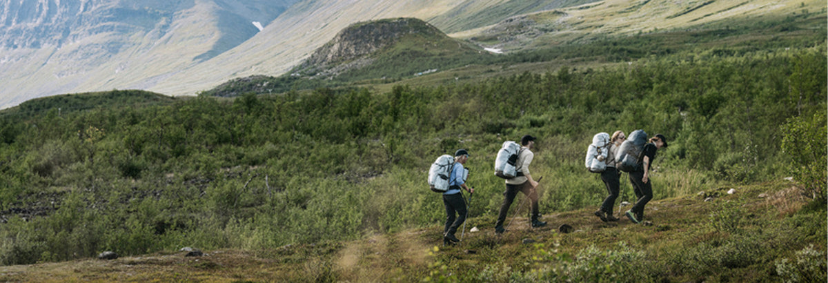 People wearing Fjallraven hiking in the mountains
